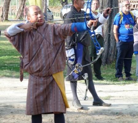 A Bhutanese archer aims at a target at the Changlimithang Archery Ground in Thimphu